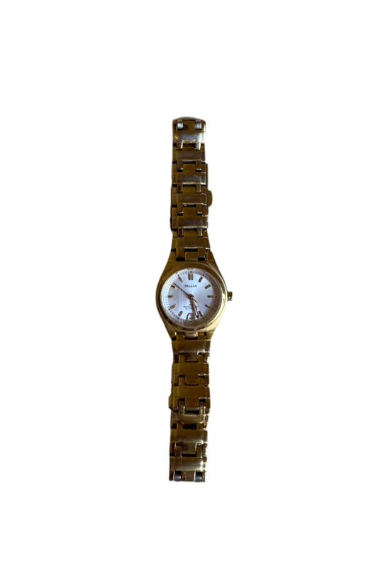 Gold Pulsar watch on a textured gray surface