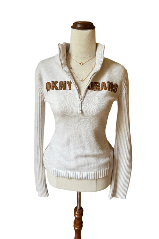 white DKNY quarter zip sweater